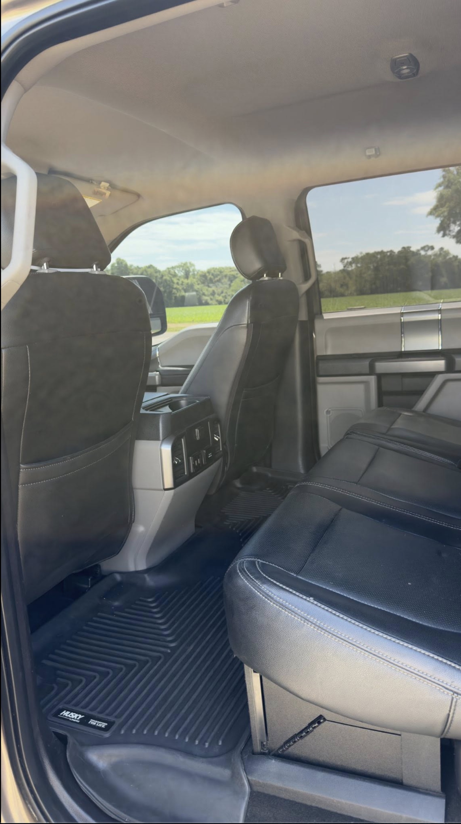 Cleaned back-row seats and WeatherTech mats of a Ford F-150 after an interior detail in Stilwell.